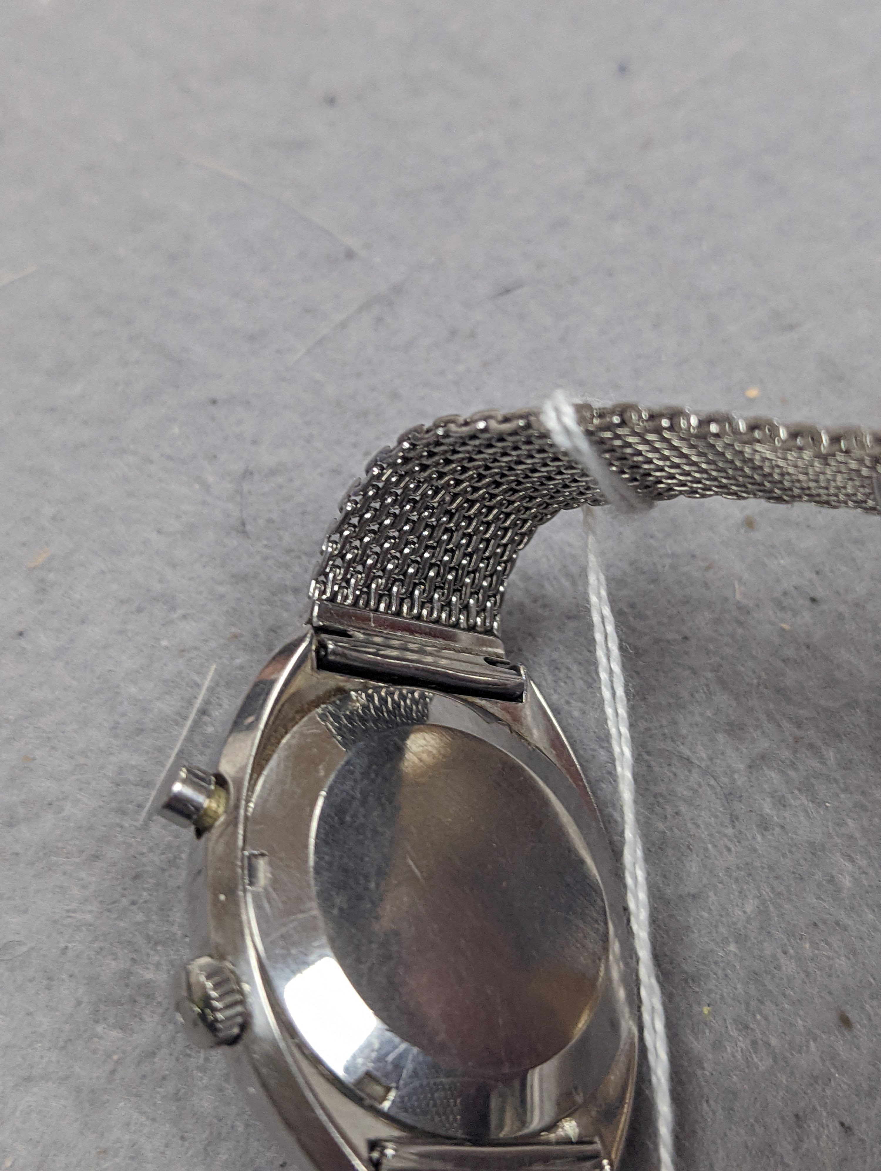 A gentleman's 1970's stainless steel Omega Chronostop manual wind wrist watch, on stainless steel Omega mesh link bracelet, case diameter 35mm, no box or papers.